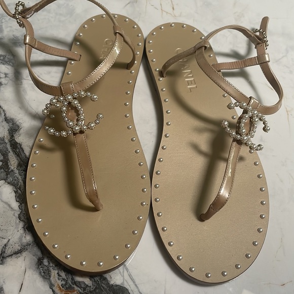 CHANEL Shoes - Chanel Nude & White Pearl Thong Flat Sandals🤍
